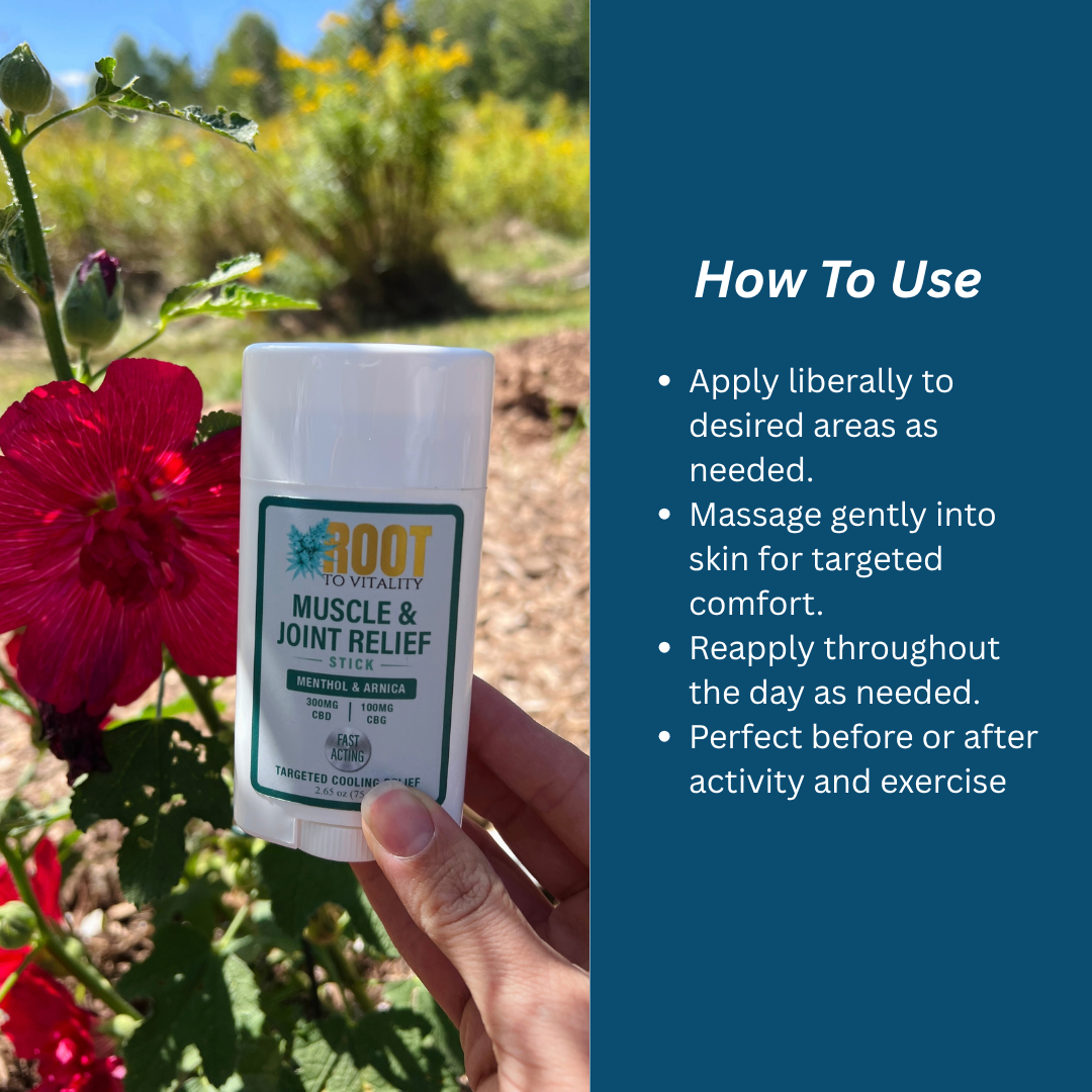 Hand holding Root To Vitality Muscle & Joint Relief Stick in a flower garden, alongside directions for applying and massaging into desired areas as needed.